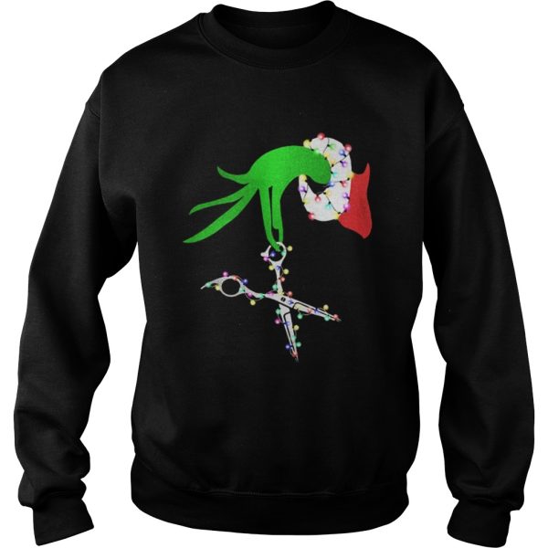 Grinch hand holds scissor hairstylist Christmas shirt